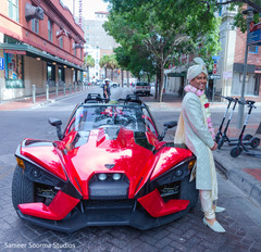 Indian groom posing by his ride Indian groom posing by his ride