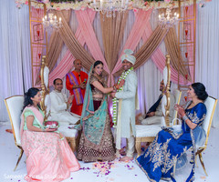 Indian couple posing for pictures at the ceremony Indian couple posing for pictures at the ceremony