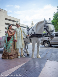 Indian bride and groom outside the venue Indian bride and groom outside the venue