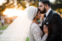 Indian groom kissing the bride. Indian groom kissing the bride.