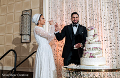 Sweet indian wedding cake cutting moment Sweet indian wedding cake cutting moment