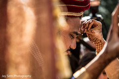Indian groom getting the Red kum-kum mark. Indian groom getting the Red kum-kum mark.