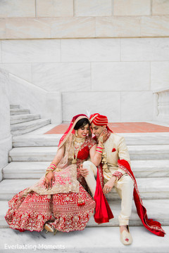 Lovely Indian bride and groom seated on the stairs. Lovely Indian bride and groom seated on the stairs.