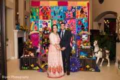 Indian couple posing by the decor Indian couple posing by the decor