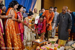 Indian bridal parents making offering to sacred fire. Indian bridal parents making offering to sacred fire.