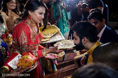 Indian groom getting special flat bread at sangeet. Indian groom getting special flat bread at sangeet.