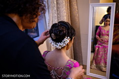 See this lovely Indian bride getting her hair done. See this lovely Indian bride getting her hair done.