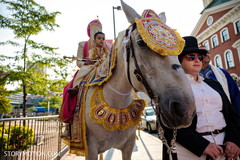 Elegant Indian groom riding baraat white horse. Elegant Indian groom riding baraat white horse.