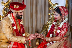 Sweet Indian couple exchanging rings. Sweet Indian couple exchanging rings.