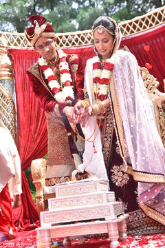 Indian bride and groom during the rajaham ritual. Indian bride and groom during the rajaham ritual.