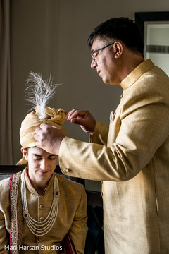Indian groom being assisted by special family guest Indian groom being assisted by special family guest