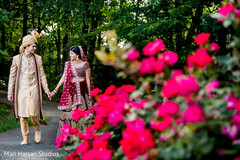 Indian groom and bride walking by the park Indian groom and bride walking by the park