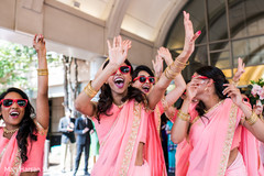 Indian bridesmaids dancing during baraat Indian bridesmaids dancing during baraat