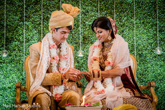 Indian bride receiving her wedding ring Indian bride receiving her wedding ring