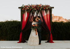 Beautiful indian couple under their wedding mandap Beautiful indian couple under their wedding mandap