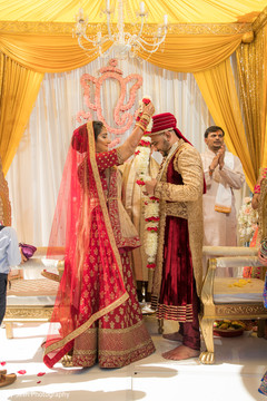Indian bride and groom exchanging garlands rituals. Indian bride and groom exchanging garlands rituals.