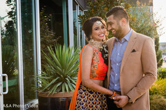 Indian bride and groom posing for pictures Indian bride and groom posing for pictures