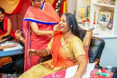Joyful Indian bride with turmeric paste on her face. Joyful Indian bride with turmeric paste on her face.