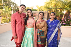 See this lovely Indian couple posing with relatives. See this lovely Indian couple posing with relatives.