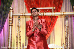 Indian groom admiring a sangeet dance. Indian groom admiring a sangeet dance.