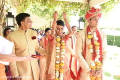 Indian bride throwing the rice back. Indian bride throwing the rice back.