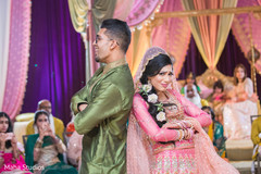 Indian bride and groom at a sangeet choreography. Indian bride and groom at a sangeet choreography.