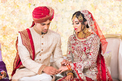 Indian groom putting ring to bride capture. Indian groom putting ring to bride capture.