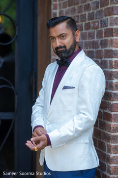 Indian groom getting ready with his tux Indian groom getting ready with his tux
