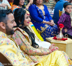 Indian bride and groom listening to the guests Indian bride and groom listening to the guests