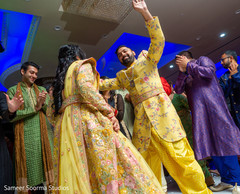 Indian bride and groom dancing Indian bride and groom dancing