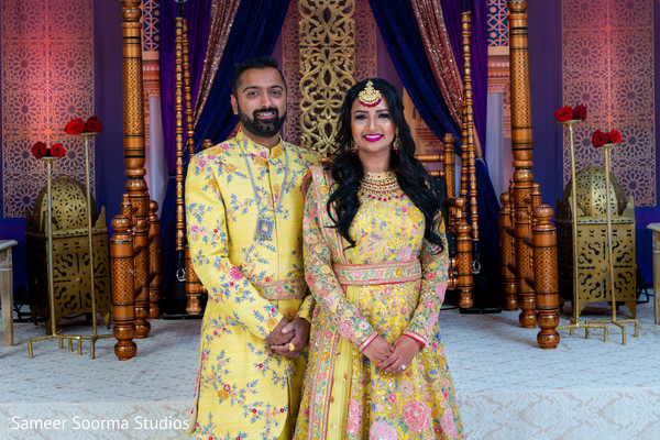 Indian bride and groom posing for pictures