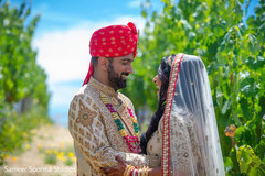 Romantic indian couple having their first look Romantic indian couple having their first look