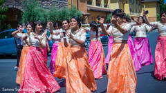 Indian bridesmaids dancing during baraat Indian bridesmaids dancing during baraat