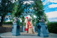 Indian bride and groom posing outdoors Indian bride and groom posing outdoors