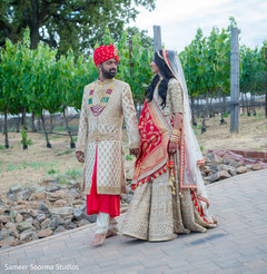 Indian bride and groom walking outdoors Indian bride and groom walking outdoors