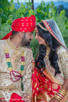 Indian bride and groom having a tender moment Indian bride and groom having a tender moment