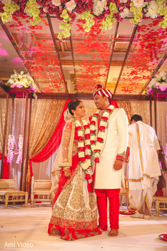 Dazzling Indian bride and groom at their ceremony. Dazzling Indian bride and groom at their ceremony.