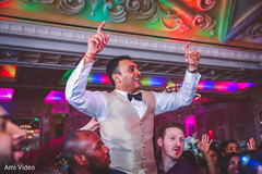 Indian groom being lifted by groomsmen. Indian groom being lifted by groomsmen.