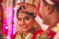 Indian bride getting the kumkum mark from groom ritual. Indian bride getting the kumkum mark from groom ritual.