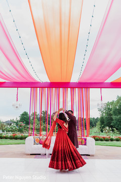 Maharani dancing with Indian groom outdoors Maharani dancing with Indian groom outdoors