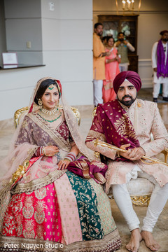 Indian bride and groom posing for pictures Indian bride and groom posing for pictures