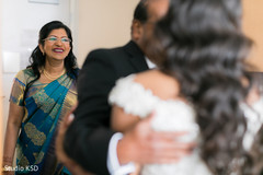Joyful surprise of indian parents looking at bride. Joyful surprise of indian parents looking at bride.