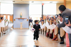 Lovely Indian pageboy walking down the aisle. Lovely Indian pageboy walking down the aisle.