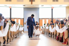 Lovely Indian flower girls walking in to ceremony. Lovely Indian flower girls walking in to ceremony.