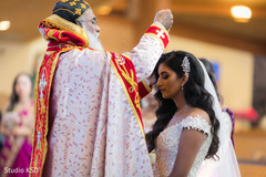 Enchanting Indian bride being blessed. Enchanting Indian bride being blessed.