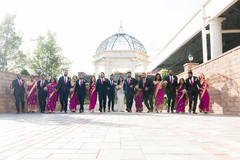 Lovely Indian couple posing outdoors with bridesmaids and groomsmen. Lovely Indian couple posing outdoors with bridesmaids and groomsmen.