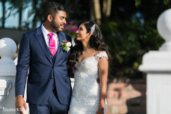 Indian bride and groom looking at each other outdoors capture. Indian bride and groom looking at each other outdoors capture.