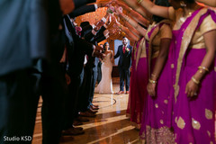Ravishing Indian bride and groom entrance to wedding reception. Ravishing Indian bride and groom entrance to wedding reception.