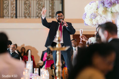 Indian groomsmen toast moment at reception. Indian groomsmen toast moment at reception.