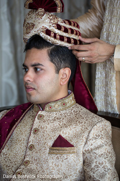Indian groom being assisted with the pagri Indian groom being assisted with the pagri